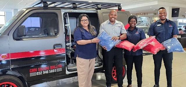 CMH Suzuki Ballito Team handing over donations at the dealership